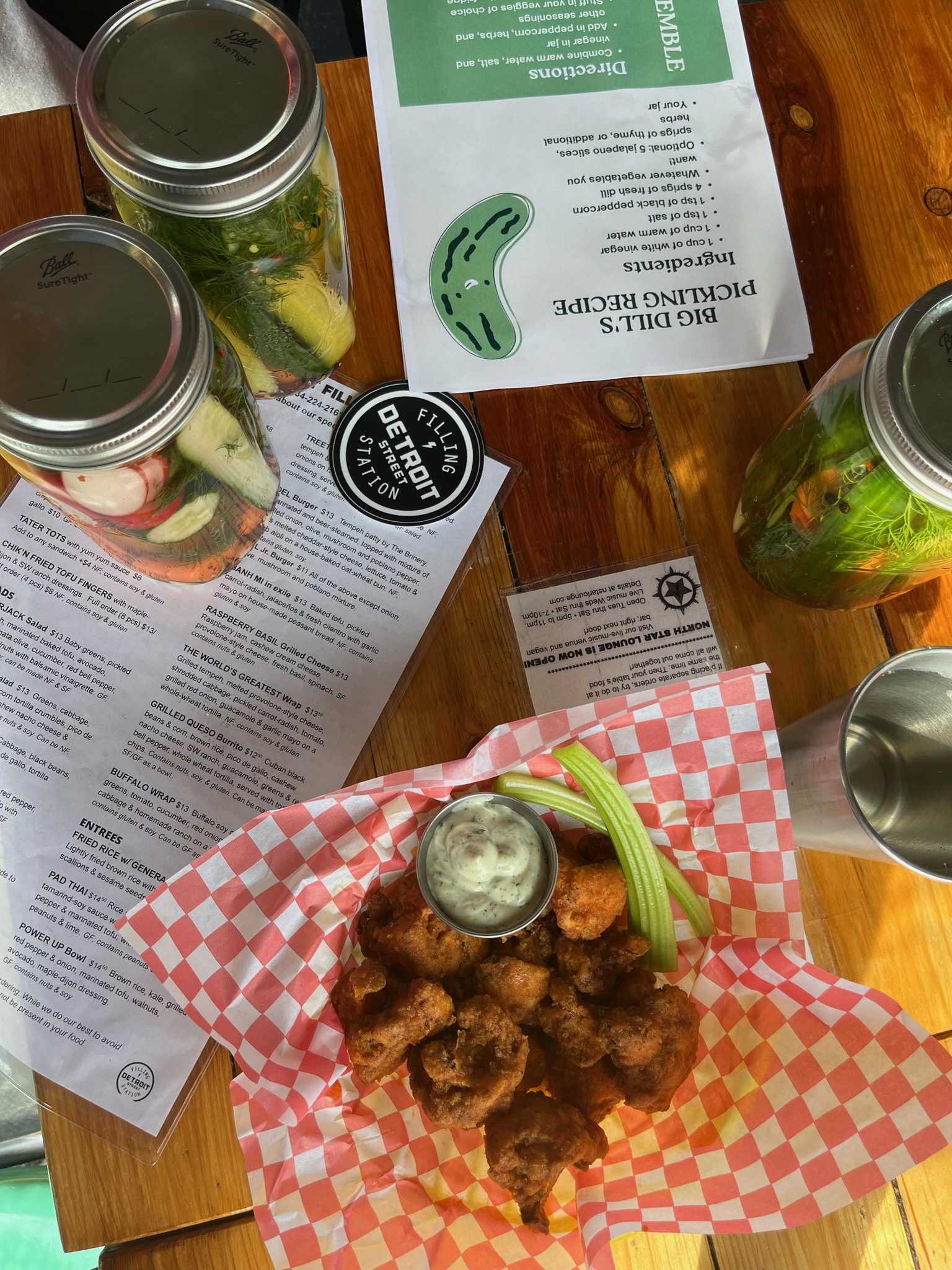 Pickles, wings, menus, and a Detroit Street Filling Station sticker