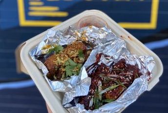 Wings on a to-go plate from Side Biscuit